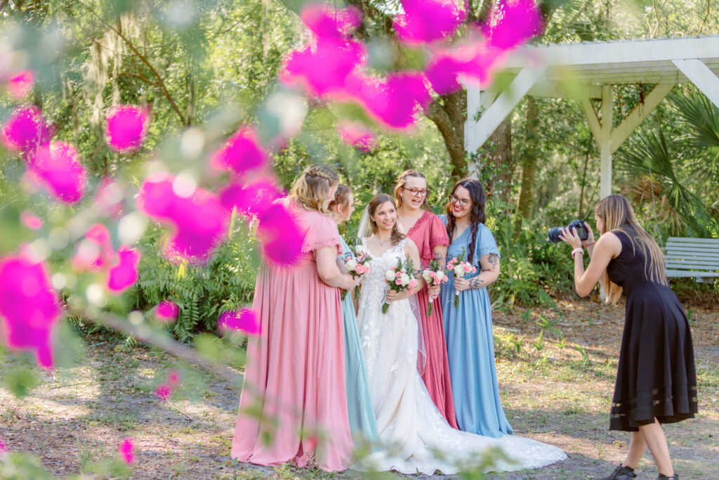 Second photographer captures lead photographer, photographing the bridal party!