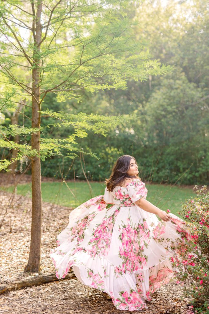 stunning woman runs through the greenery at Bok Tower Gardens for her engagement session feeling confident and beautiful.